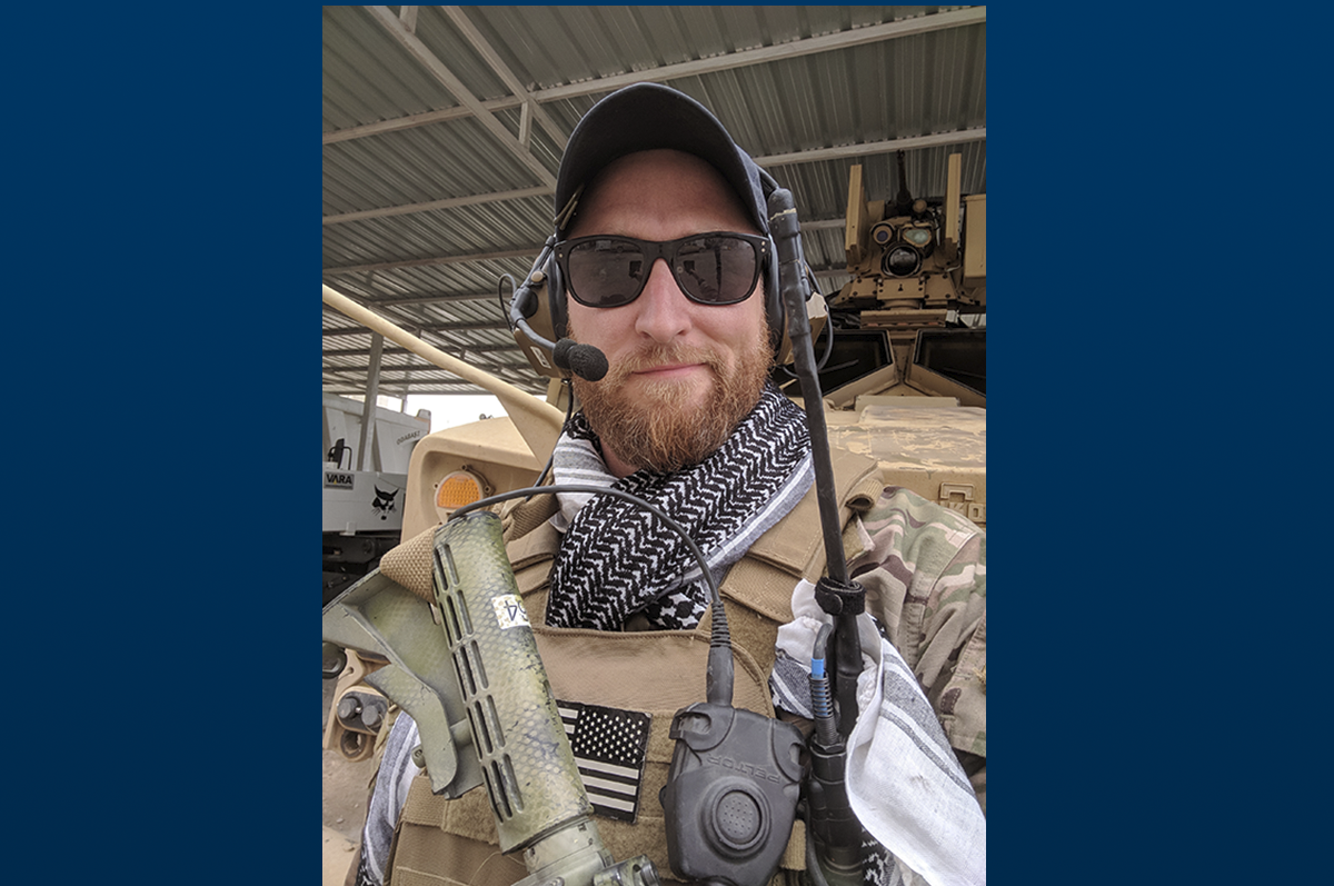 soldier wearing camo holding gun